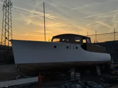 The freshly painted hull at sunset — March 2025