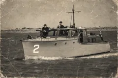 Gerfalcon underway with her crew — sepia photograph