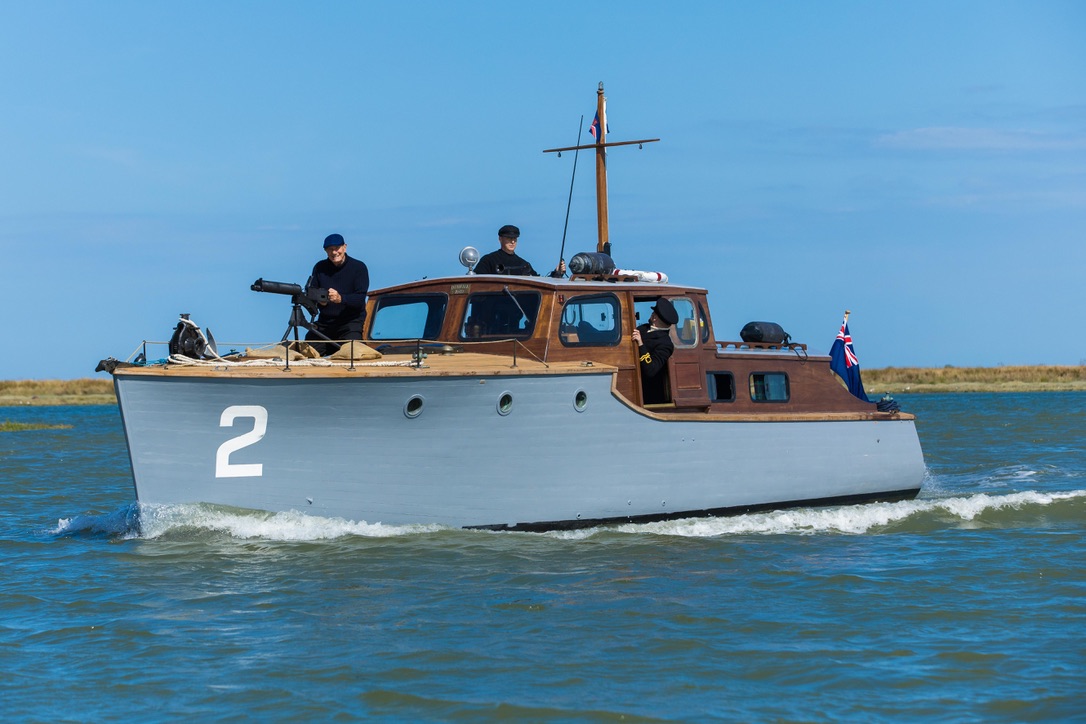 Gerfalcon underway, with her timber cabin and grey hull